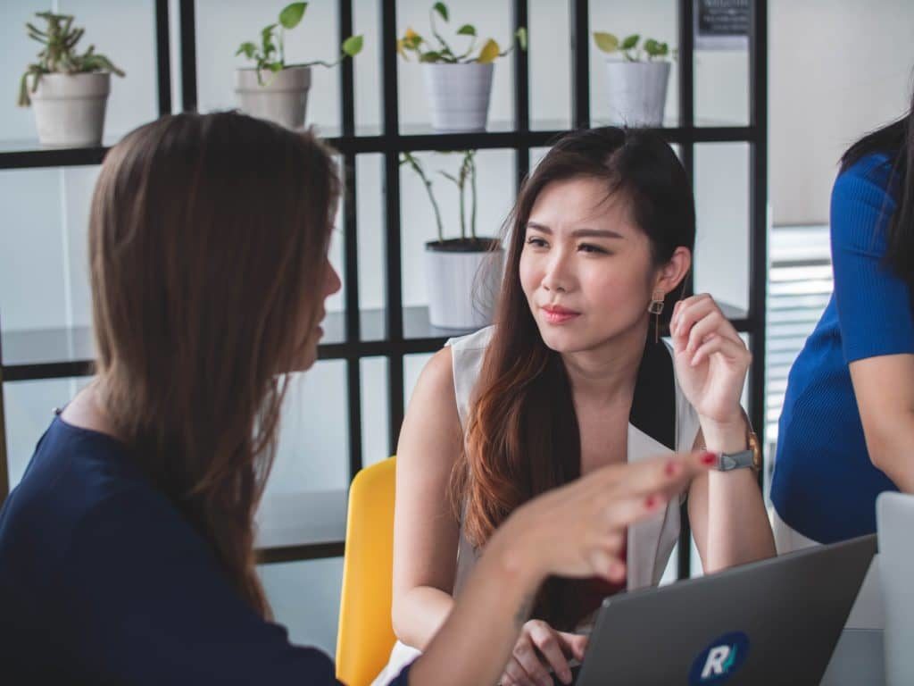 Manager conversing with employee